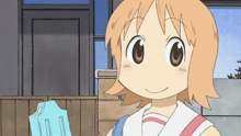 a cartoon girl with orange hair is smiling and holding a blue box