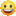 a blurry picture of a yellow smiley face with a big smile on it .