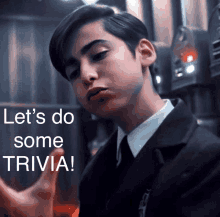 a young man in a suit and tie with the words let 's do some trivia