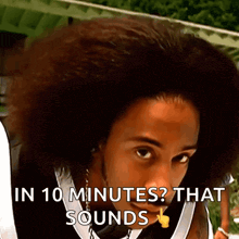 a man with a big afro has the words in 10 minutes that sounds on his face