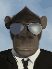 a chimpanzee wearing a suit and tie is wearing sunglasses