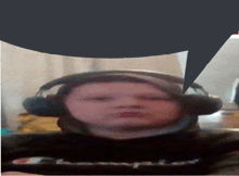 a person wearing headphones with a speech bubble above them