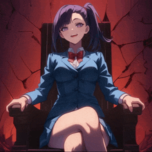 a girl in a blue suit sits in a chair