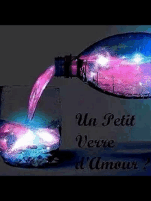 a bottle of liquid is pouring into a glass with the words un petit verre d' amour written on the bottom