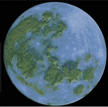 a blue full moon with green spots on the surface