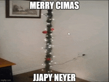 a picture of a christmas tree with a caption that says merry cimas jjapy neyer