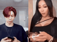 a man with red hair and a woman with black hair are looking at their cell phones