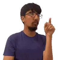 a pixelated image of a man wearing glasses and a blue shirt
