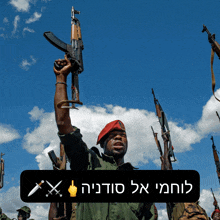 a man in a red beret is holding a gun in the air above a sign that says ' x ' on it