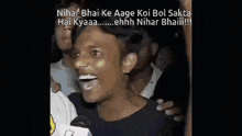 a man is laughing in front of a microphone with the words nihar bhai ke aage koi bol sakta