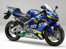 a blue motorcycle with movistar written on the front