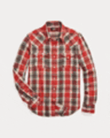 a red and black plaid shirt with long sleeves and pockets on a white background .