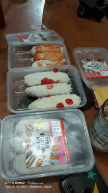 several containers of frozen mozzarella sticks are sitting on a table