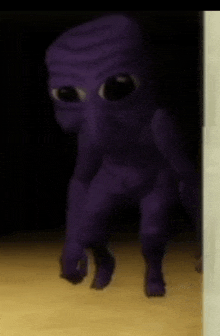 a purple alien is standing in a dark room .