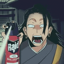 a man is holding a can of raid bug spray in his hand .