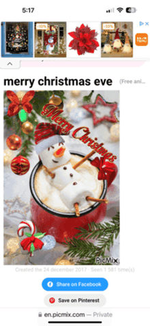 a phone screen shows a merry christmas eve image