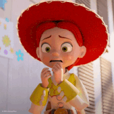 jessie from toy story is wearing a red hat and yellow shirt