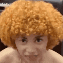 a close up of a person 's face with a wig on