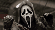 a person wearing a scream mask holding a bloody knife