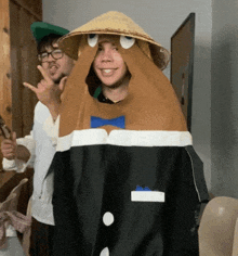 a man in a potato costume stands next to another man wearing glasses