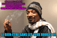 snoop dogg is wearing a black beanie and scarf and smoking a cigar