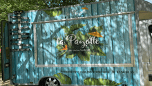 a blue and white food truck says la payotte