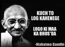 a black and white photo of mahatma gandhi with glasses and a quote from him .