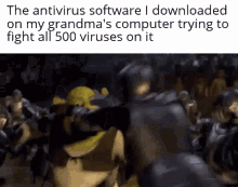 shrek fighting batman in front of a crowd with the caption the antivirus software i downloaded