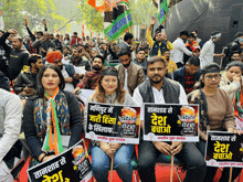 a group of people holding signs that say " desh " on them