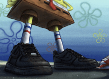 a picture of spongebob wearing a pair of black nike shoes