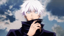 a man with white hair and blue eyes is standing in front of a cloudy sky with his hand on his chin .