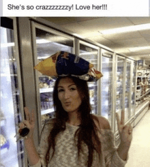 a woman wearing a bag of potato chips on her head