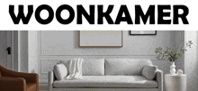 a living room with a couch and a chair and the word woonkamer above it