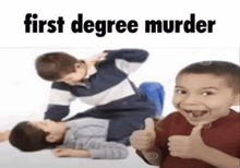 a boy is giving a thumbs up in front of two boys fighting