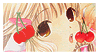 a close up of a girl with cherries on her face .