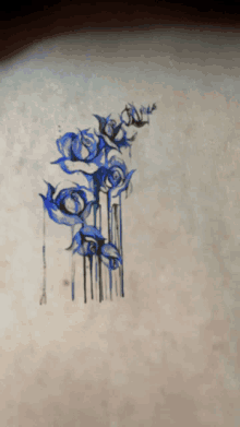 a drawing of a bunch of blue flowers on a white background