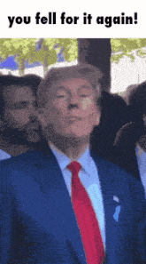 a picture of a man in a suit and tie with the caption " you fell for it again "