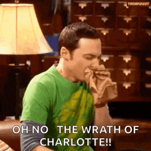a man in a green shirt is blowing his nose and says oh no the wrath of charlotte