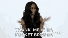 a woman in a black dress is dancing and saying `` thank me in da pocket bradda '' .