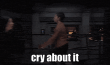 a woman is dancing in a dark room with the words cry about it on the bottom