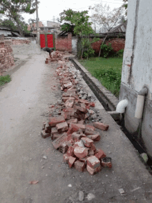 a pile of bricks sits on the side of the road