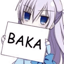 a girl is holding a sign that says baka in her hands .