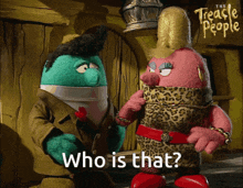 a couple of stuffed animals standing next to each other with the words " who is that " above them