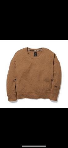 a brown sweatshirt with a black tag that says ' abercrombie & fitch ' on it