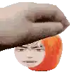 a hand is holding a person 's head with a red haired face .