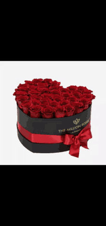 a heart shaped box with red roses and the words the million roses on it