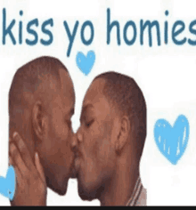 two men are kissing in front of a sign that says " kiss yo homies "