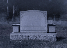 an empty gravestone in a cemetery at night with smoke coming out of the ground .