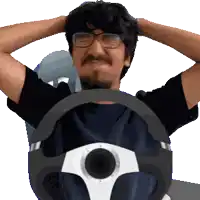 a man with glasses and a mustache is driving a car with his hands on his head