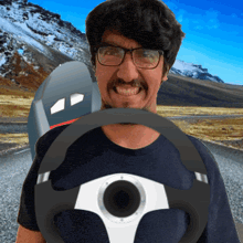 a man wearing glasses is holding a steering wheel